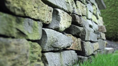Rock retaining wall landscaping Stock Footage 74836964