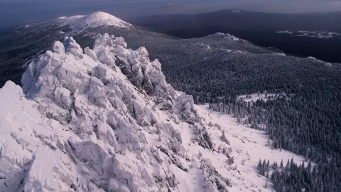 A rock ridge that looks like dragon. Flying Over Mountain Peaks in winter  Stock Footage 126218853