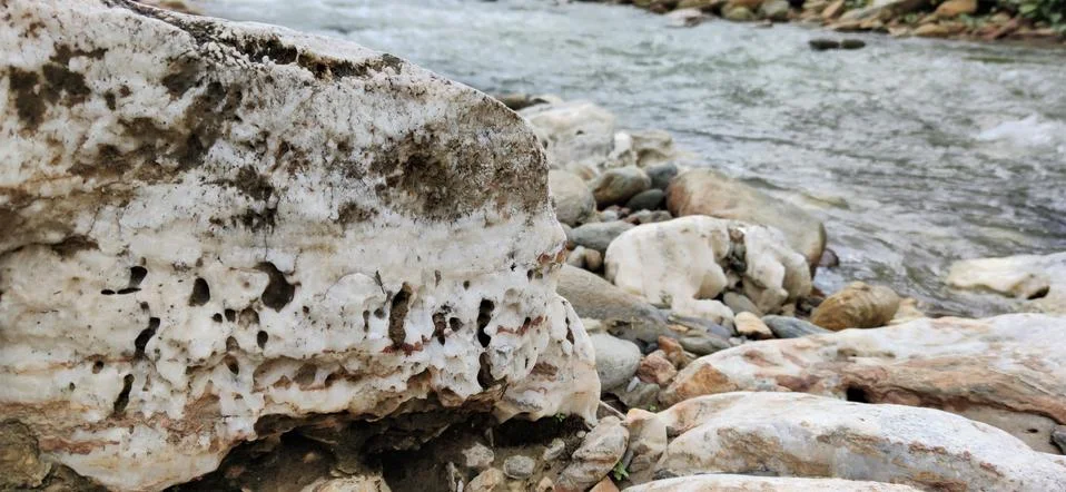 Rock at river side Stock Photos