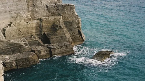 Rock. A rock about which waves beat. Stock Footage 123573164