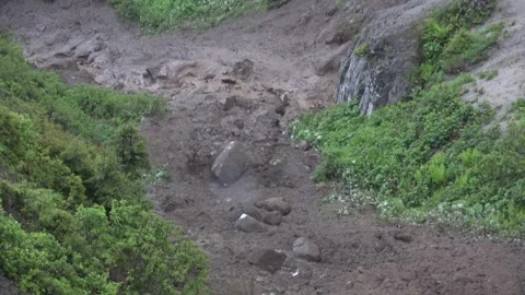 Rock rolls down landslide slope with loose stones - Stone Rock and Soil Erosion 스톡 동영상 339813143