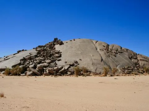 Rock with a round back Stock Photos