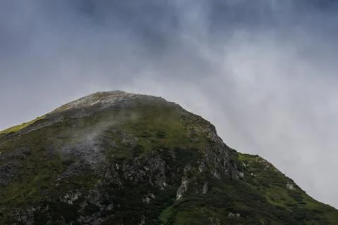 Rock round peak while hiking in the mountains Stock Photos