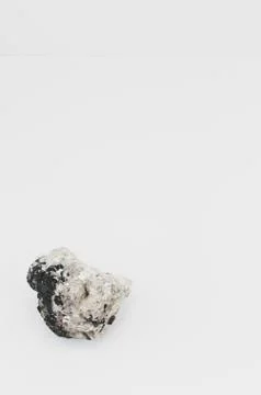 Rock sample on a blank light surface Stock Photos