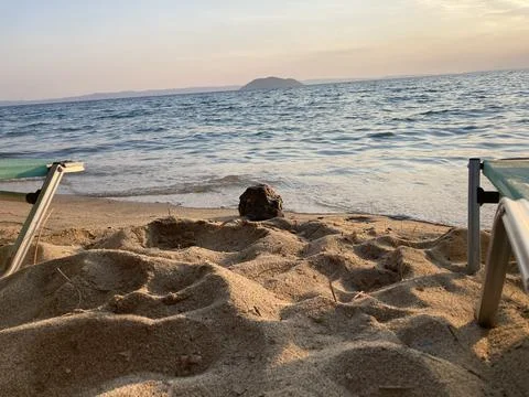 Rock in the sand on beach Stock Photos