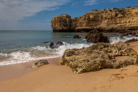 Rock on a sandy beach Stock Photos