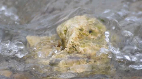 Rock in sea waves Stock Footage 22748091