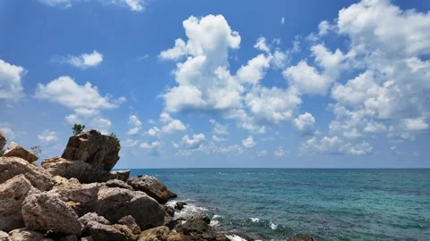 Rock seashore against cloudy sky at samet island. Stockbeeldmateriaal 274371683