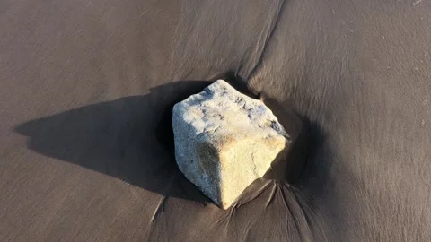 A rock is sitting on the sand Stock Footage 270801374