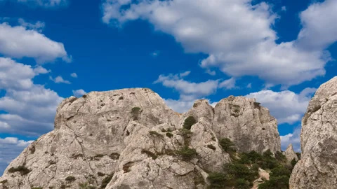 Rock on a sky background time lapse scene Stock Footage 273705340