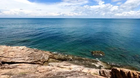 Rock Slope with view horizon between of blue sky and sea,  in summer season Stock Footage 193986048