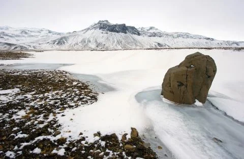 Rock in the snow Stock Photos