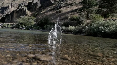 Rock Splashing in Clear River Stock Footage 99798354