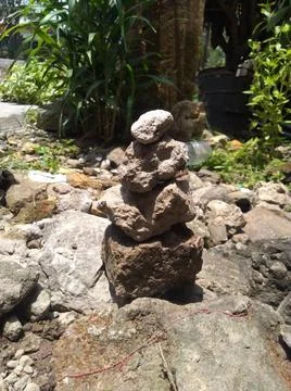 Rock Stack or Stone Balancing in the Garden Stock Photos