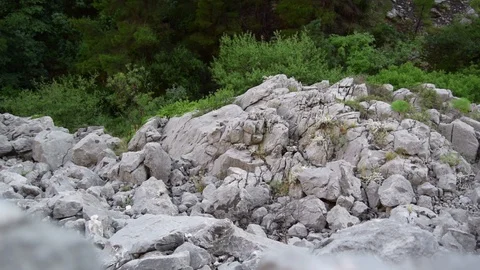 Rock stone landscape with rock pebbles being thrown in Omis Town Croatia Stock Footage 104329135