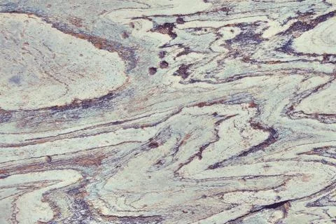 Rock stones pattern grey background. Stone texture with billowy lines. Stock Photos
