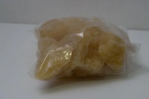 Rock sugar, in the form of irregular lumps and in smoother Stock Photos