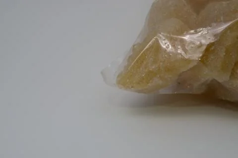 Rock sugar, in the form of irregular lumps and in smoother Stock Photos