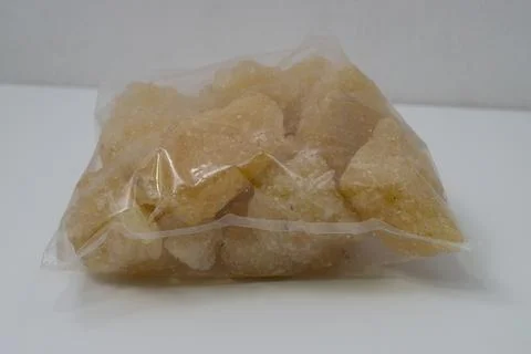 Rock sugar, in the form of irregular lumps and in smoother Stock Photos