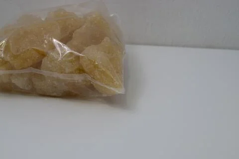 Rock sugar, in the form of irregular lumps and in smoother Stock Photos
