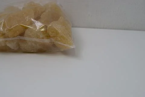 Rock sugar, in the form of irregular lumps and in smoother Stock Photos