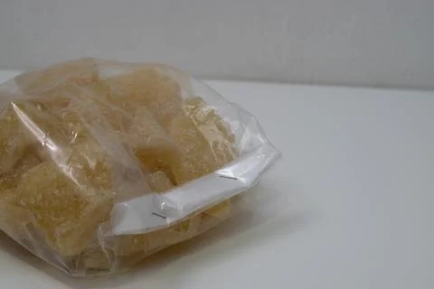Rock sugar, in the form of irregular lumps and in smoother Stock Photos