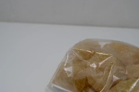 Rock sugar, in the form of irregular lumps and in smoother Stock Photos
