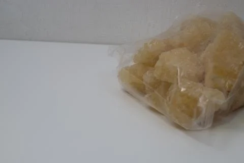 Rock sugar, in the form of irregular lumps and in smoother Stock Photos