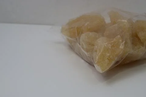 Rock sugar, in the form of irregular lumps and in smoother Stock Photos