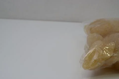 Rock sugar, in the form of irregular lumps and in smoother Stock Photos