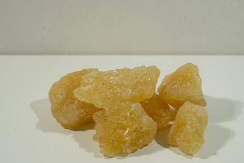 Rock sugar, in the form of irregular lumps and in smoother Stock Photos