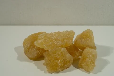 Rock sugar, in the form of irregular lumps and in smoother Stock Photos