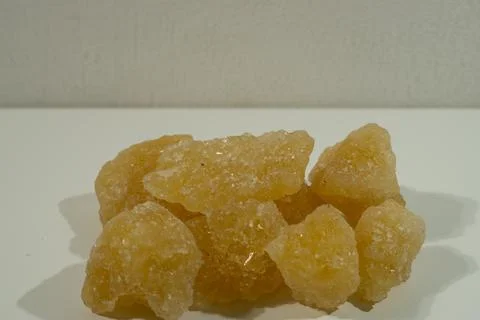 Rock sugar, in the form of irregular lumps and in smoother Stock Photos