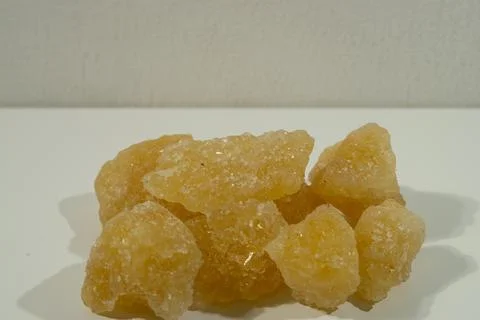 Rock sugar, in the form of irregular lumps and in smoother Stock Photos