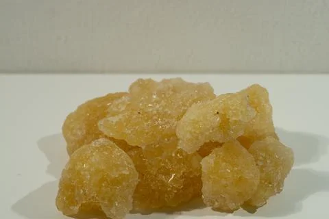 Rock sugar, in the form of irregular lumps and in smoother Stock Photos