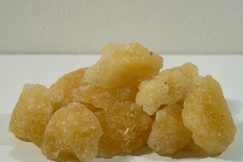 Rock sugar, in the form of irregular lumps and in smoother Stock Photos