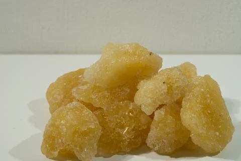 Rock sugar, in the form of irregular lumps and in smoother Stock Photos