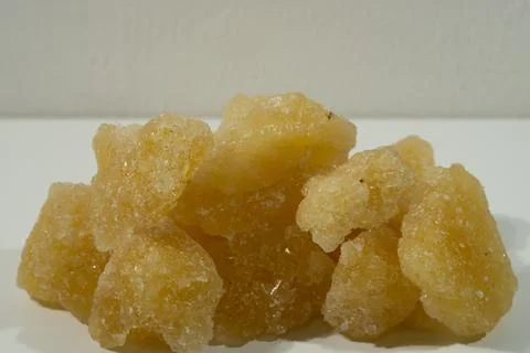 Rock sugar, in the form of irregular lumps and in smoother Stock Photos