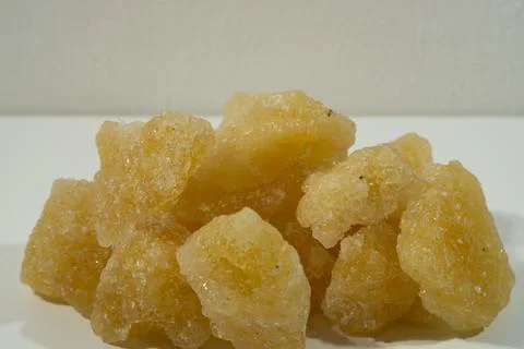 Rock sugar, in the form of irregular lumps and in smoother Stock Photos