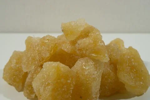 Rock sugar, in the form of irregular lumps and in smoother Stock Photos