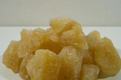 Rock sugar, in the form of irregular lumps and in smoother Stock Photos