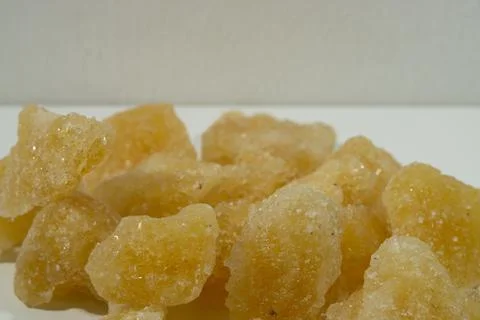 Rock sugar, in the form of irregular lumps and in smoother Stock Photos