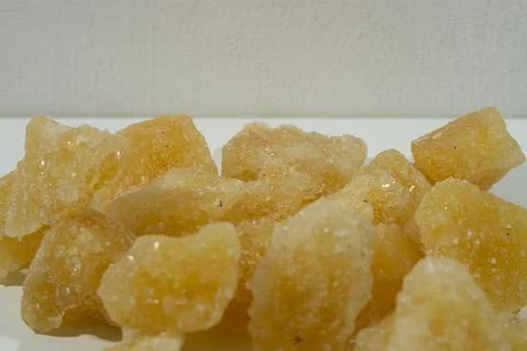 Rock sugar, in the form of irregular lumps and in smoother Stock Photos