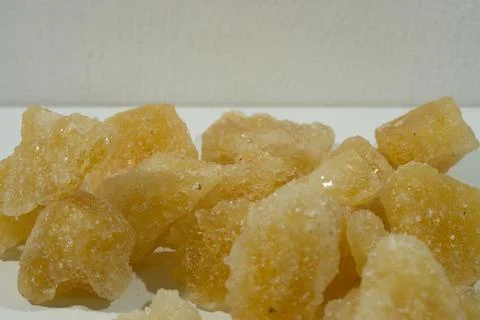 Rock sugar, in the form of irregular lumps and in smoother Stock Photos