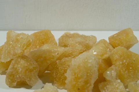 Rock sugar, in the form of irregular lumps and in smoother Stock Photos