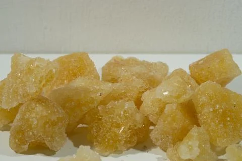 Rock sugar, in the form of irregular lumps and in smoother Stock Photos