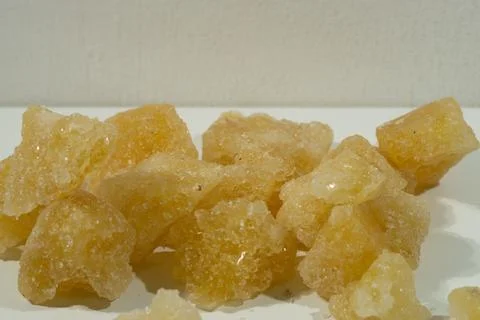 Rock sugar, in the form of irregular lumps and in smoother Stock Photos