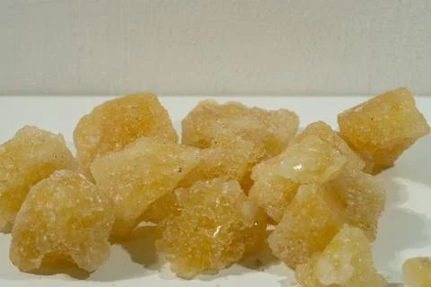 Rock sugar, in the form of irregular lumps and in smoother Stock Photos