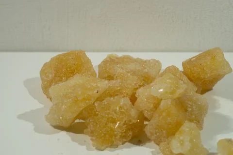 Rock sugar, in the form of irregular lumps and in smoother Stock Photos