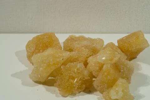 Rock sugar, in the form of irregular lumps and in smoother Stock Photos